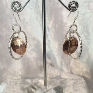 Twisted silver wire earrings with solid copper centre disc